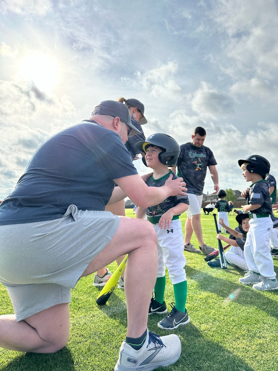 Coaching my son at one of his first tee ball games